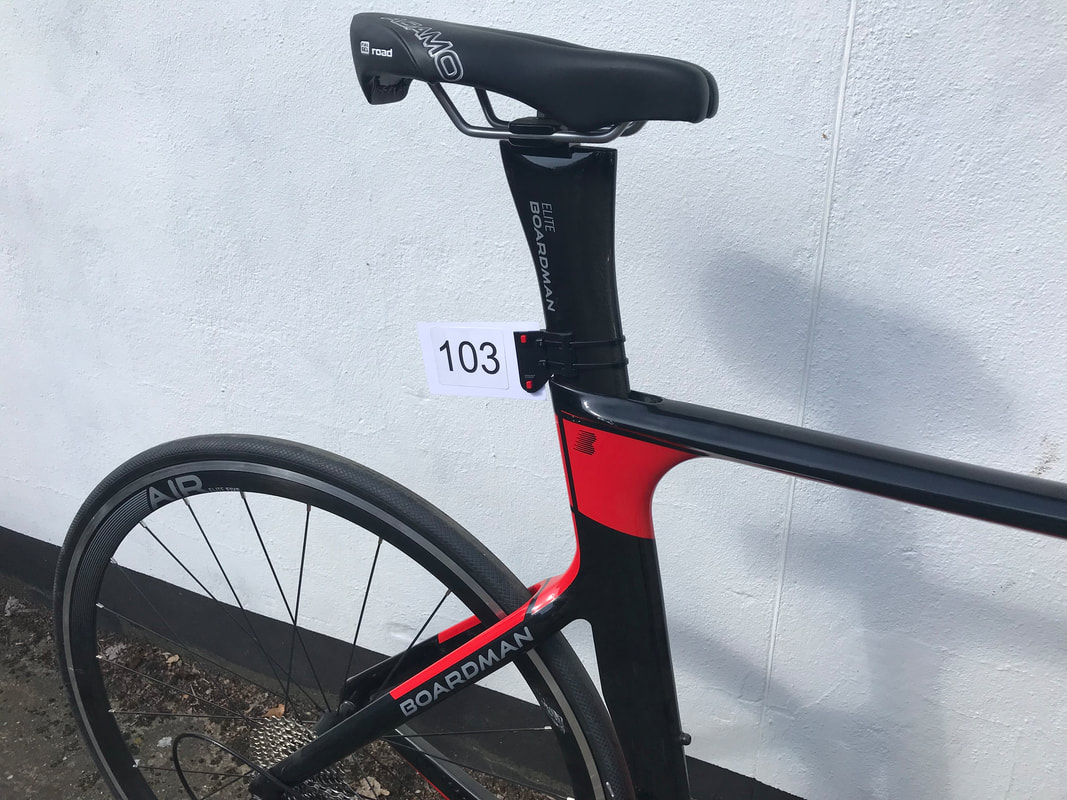 A bike numbering clip mounted on a streamline raod bike