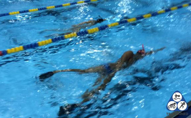 Swimmer performing a double wide swim kick drill in Sudbury with Tri-Trained