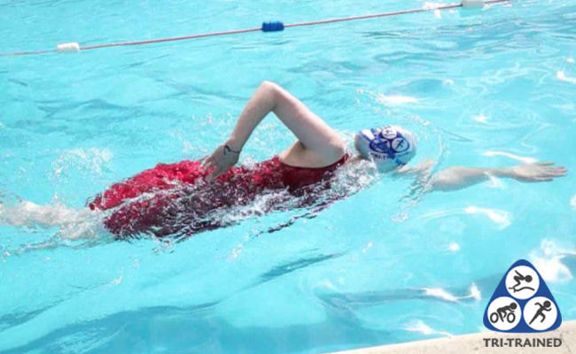 Swimmer performing a shark fin swim drill in Sudbury with Tri-Trained